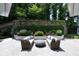 Landscaped backyard patio with seating and water feature at 3244 Stillhouse Rd, Atlanta, GA 30339