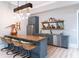 Basement bar with a copper still, custom cabinetry, and bar seating at 3244 Stillhouse Rd, Atlanta, GA 30339