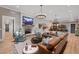 Finished basement with a large sectional sofa, fireplace and bar at 3244 Stillhouse Rd, Atlanta, GA 30339