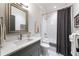 Clean bathroom with white subway tiles and gray vanity at 3244 Stillhouse Rd, Atlanta, GA 30339