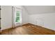 Bright bedroom with hardwood floors and a window with natural light at 3244 Stillhouse Rd, Atlanta, GA 30339
