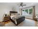 Comfortable bedroom with wooden bed frame and large windows at 3244 Stillhouse Rd, Atlanta, GA 30339