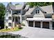 Two-story house with a three-car garage and manicured landscaping at 3244 Stillhouse Rd, Atlanta, GA 30339