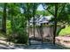 Luxury home nestled in a wooded area, gated entrance at 3244 Stillhouse Rd, Atlanta, GA 30339
