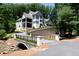 House with a bridge and driveway, surrounded by lush greenery at 3244 Stillhouse Rd, Atlanta, GA 30339