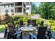 Stone fire pit with surrounding seating area in a landscaped backyard at 3244 Stillhouse Rd, Atlanta, GA 30339