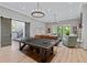 Basement game room with ping pong table, comfortable seating, and stylish light fixtures at 3244 Stillhouse Rd, Atlanta, GA 30339