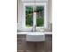 Farmhouse sink and hexagon tile accentuate this bright kitchen at 3244 Stillhouse Rd, Atlanta, GA 30339