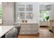 Kitchen features gray cabinets, white countertops, and decorative wall art at 3244 Stillhouse Rd, Atlanta, GA 30339