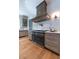 Modern range and custom hood take center stage in this stylish kitchen at 3244 Stillhouse Rd, Atlanta, GA 30339
