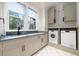 Convenient laundry room with washer, dryer, and ample counter space at 3244 Stillhouse Rd, Atlanta, GA 30339