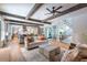 Open living room with hardwood floors and exposed beams at 3244 Stillhouse Rd, Atlanta, GA 30339