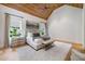 Spacious main bedroom with wood ceilings and large windows at 3244 Stillhouse Rd, Atlanta, GA 30339