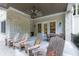 Spacious patio with wooden chairs and a view of the home's exterior at 3244 Stillhouse Rd, Atlanta, GA 30339