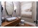 Stylish powder room with wood vanity and modern fixtures at 3244 Stillhouse Rd, Atlanta, GA 30339