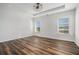 Bright bedroom with wood-look floors and two windows, offering ample natural light at 3620 Princeton Ave, College Park, GA 30337