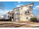 Tan two story house with multiple windows and a deck at 6180 Chastain Way, Fairburn, GA 30213