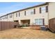Backyard view of home with patio, fence, and landscaping at 1328 Stone Bay Sw Dr, South Fulton, GA 30331