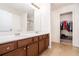 Double vanity bathroom with shower and adjacent closet at 1328 Stone Bay Sw Dr, South Fulton, GA 30331