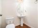 Clean and updated bathroom with pedestal sink and oval mirror at 1328 Stone Bay Sw Dr, South Fulton, GA 30331