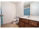 Clean bathroom with brown vanity, tiled shower, and toilet at 1328 Stone Bay Sw Dr, South Fulton, GA 30331