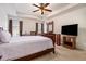 Spacious main bedroom with ceiling fan and hardwood floors at 1328 Stone Bay Sw Dr # 282, South Fulton, GA 30331