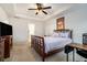Spacious main bedroom with ceiling fan and hardwood floors at 1328 Stone Bay Sw Dr, South Fulton, GA 30331