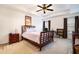 Spacious main bedroom with ceiling fan and hardwood floors at 1328 Stone Bay Sw Dr, South Fulton, GA 30331