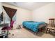 Cozy bedroom with teal bedding, a workspace, and rocking chair at 1328 Stone Bay Sw Dr, South Fulton, GA 30331