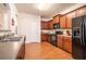 Modern kitchen featuring ample cabinetry, stainless steel appliances, and hardwood floors at 1328 Stone Bay Sw Dr, South Fulton, GA 30331