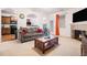 Open living room with kitchen view, fireplace and seating at 1328 Stone Bay Sw Dr, South Fulton, GA 30331