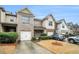 Charming townhome with brick and siding exterior, attached garage, and well-maintained landscaping at 1328 Stone Bay Sw Dr, South Fulton, GA 30331