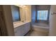 Bathroom with double vanity, soaking tub, and separate shower at 2343 Buford Town Dr, Buford, GA 30518