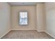 Small bedroom with window and carpeted floor at 2343 Buford Town Dr, Buford, GA 30518