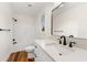 Updated bathroom with white vanity, quartz countertop, and modern fixtures at 2473 Baker Rd, Atlanta, GA 30318