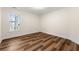 Bright bedroom featuring wood-look flooring and ample natural light at 2473 Baker Rd, Atlanta, GA 30318