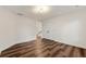 Spacious bedroom with double doors and wood-look flooring at 2473 Baker Rd, Atlanta, GA 30318