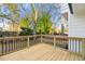 Wooden deck overlooks backyard with a view of trees at 2473 Baker Rd, Atlanta, GA 30318