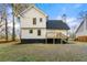Rear view of a white two-story house with a deck at 2473 Baker Rd, Atlanta, GA 30318
