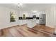 Modern kitchen with white cabinets, stainless steel appliances, and an island at 2473 Baker Rd, Atlanta, GA 30318