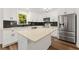 Modern kitchen with white cabinets, stainless steel appliances and an island at 2473 Baker Rd, Atlanta, GA 30318