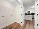 Laundry room with shelving and view into the kitchen at 2473 Baker Rd, Atlanta, GA 30318
