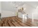 Open living area featuring hardwood floors, high ceilings, and a fireplace at 2473 Baker Rd, Atlanta, GA 30318