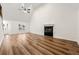 Vaulted ceiling living room with hardwood floors and a fireplace at 2473 Baker Rd, Atlanta, GA 30318