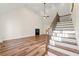 Spacious living room with vaulted ceiling, fireplace, and hardwood floors at 2473 Baker Rd, Atlanta, GA 30318