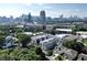 Aerial view of townhouses and cityscape in the background at 443 Plateau Nw Pl, Atlanta, GA 30309