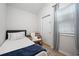 Small bedroom with twin bed, chair, and access to exterior at 6412 Wedgeview Dr, Tucker, GA 30084