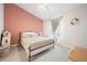 Bedroom with a queen bed and accent wall at 6412 Wedgeview Dr, Tucker, GA 30084