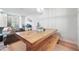 Light and airy dining area with a farmhouse-style table and bench at 6412 Wedgeview Dr, Tucker, GA 30084