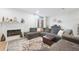 Comfortable living room with sectional sofa, fireplace, and large TV at 6412 Wedgeview Dr, Tucker, GA 30084